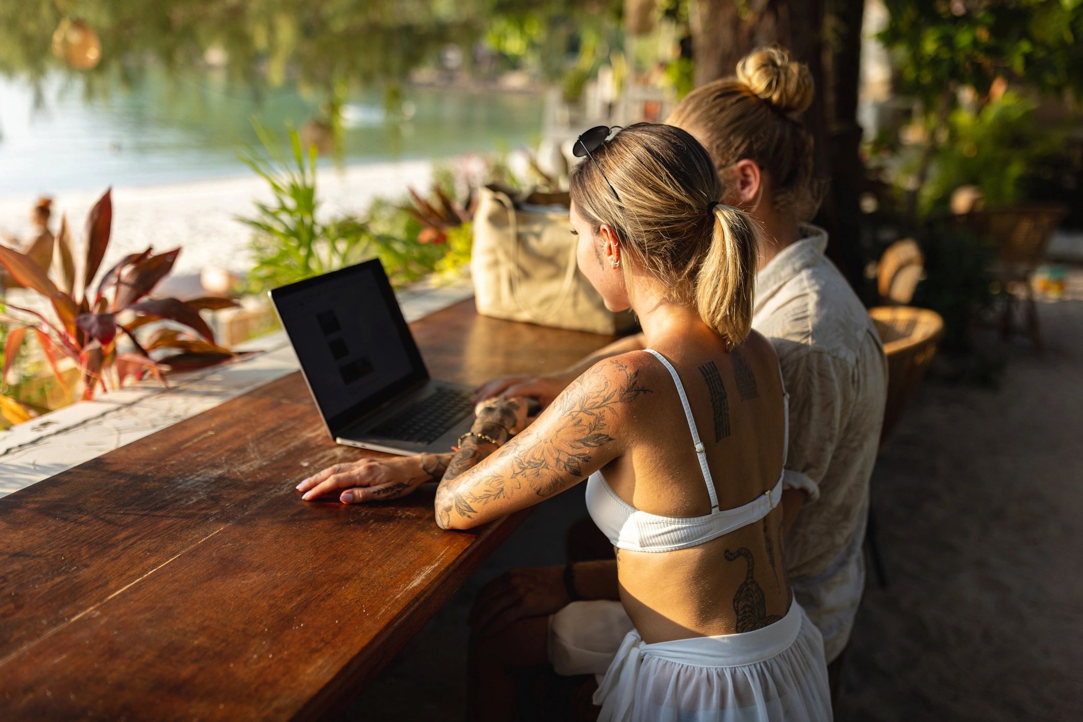 Couple planning a vacation together on a laptop